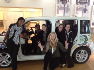 Some of the SOM Japan ladies pose with a Nissan Cube.