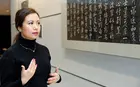 Crystal Zhang in front of artwork