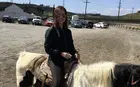 Crystal Zhang riding a horse