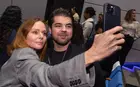 Stella McCartney taking a selfie with a student
