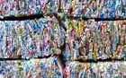 Bundles of crushed plastic containers