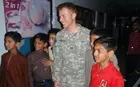 A soldier with kids on Pakistan