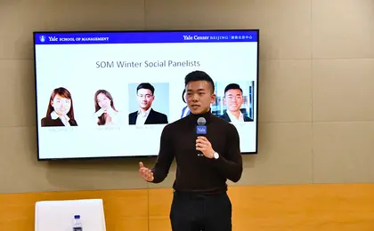 Austin Cai ’25 introducing panelists at a winter social in Beijing