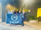 Yale SOM students at GNW in Australia holding the Yale flag
