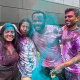 Four people celebrating Holi