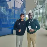 Amaan Hassanali with a CEO during the Global CEO conference