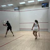 Oscar Franz and friend playing squash