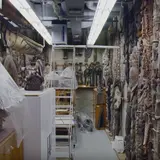 Back room of Peabody museum, dense with materials on shelves
