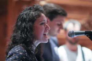 The lovely Caren '13 sings with Clint '13 and Josh '13 in the background. Photo by Alina Vorobeitchik '14.