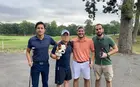 four people in golf attire