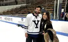 Daniel Reshef in hockey uniform and Laura Arrazola
