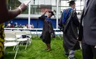 A student celebrating at commencement