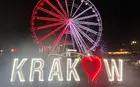 ferris wheel with a sign that says Krakov in front of it