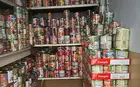 stacks of canned goods filling a storage room
