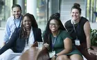 Diverse group of students smiling and facing camera