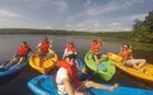 Nicole Cheng and friends in kayaks on a lake