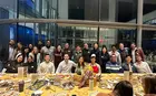 Friendsgiving: students around a thanksgiving inspired table