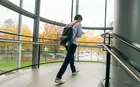 A student walking up the stairs