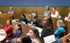 Kehli Harding Woodruff raises her hand during a session