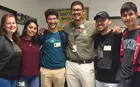 A group of teachers and students smiling