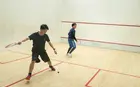 Two people playing squash