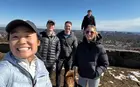 A group of people in jackets hiking