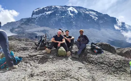 Liam Bartlett with 2 friends on mountain top