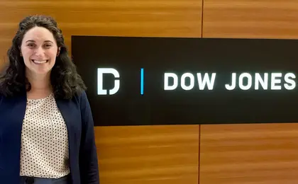 Tali in front of Dow Jones sign