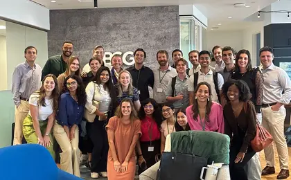 A group of people posing for a photo in an office space