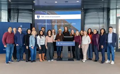 Large group of students in front of a presentation screen