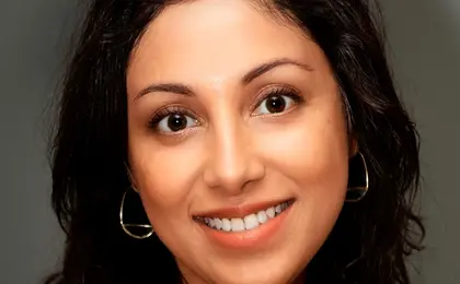 A close-up photo of a person smiling