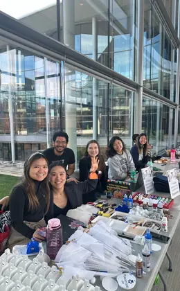 A group of students manning a table at an event