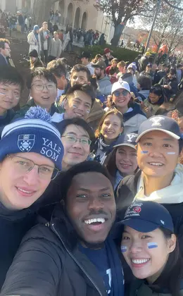 Several people in Yale athletic gear posing for a selfie