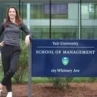 Gillian Cafiero next to Yale School of Management sign