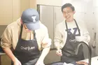 Steven Wen cooking with a friend
