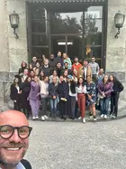 Students posing with professor at villa in Italy