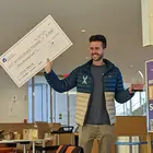 person holding giant check