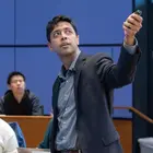 A professor lecturing in a classroom