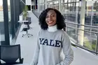 photo of Christiana Opoku in a Yale sweatshirt outside in the Evans Hall courtyard