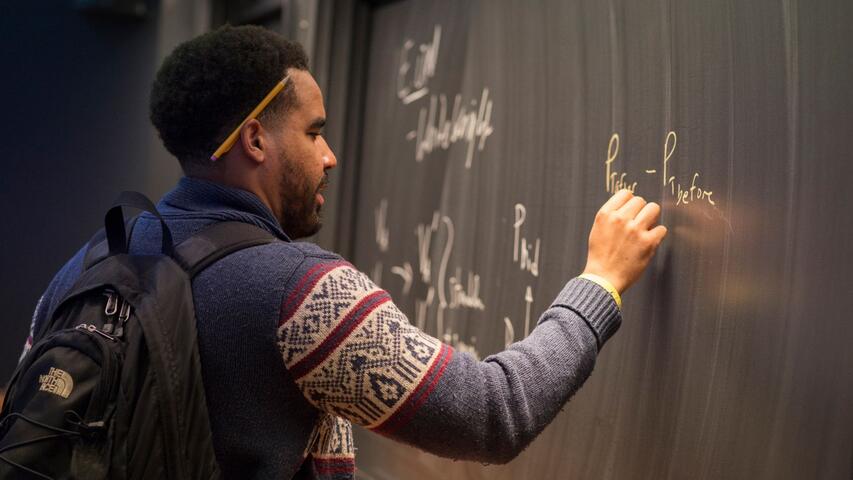 Student drawing on the board