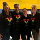 group of four people wearing Yale Pride T-shirts