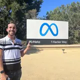 Nick Zeffiro in front of Meta sign