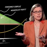 A professor explaining an economic concept in front of an animated chart