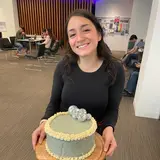 Person holding cake