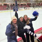Three friends at hockey rink