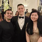 Robert Lucas with friends at a formal event