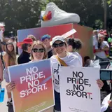 Jackie Peszynski, Kelsey Niehoff walking with Nike Inc. in the 2023 Portland Pride parade.
