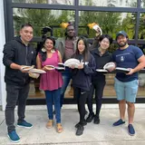 group of friends holding plates of food