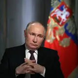 Putin with hands folded