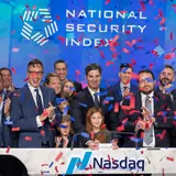 A group of adults and children celebrating the opening of the National Security Index